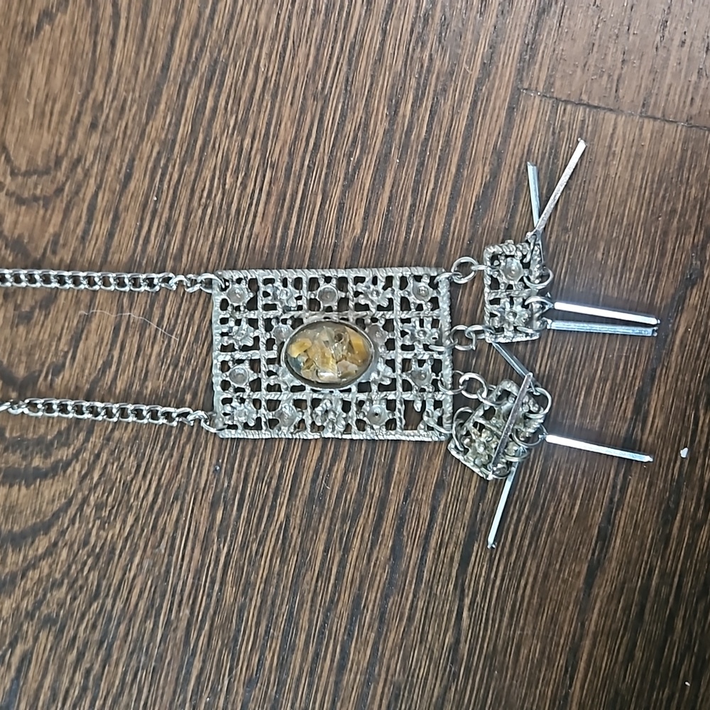 Long silver tone necklace with stone